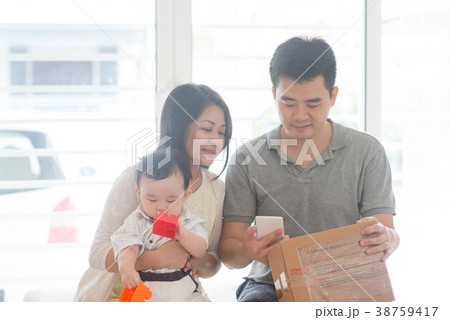 Chinese father scanning QR code Chinese father scanning QR code 38759417