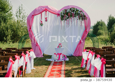 wedding arch for ceremony decorated with white and 38759430