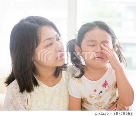 Mother comforts crying daughter. Mother comforts crying daughter. 38759668
