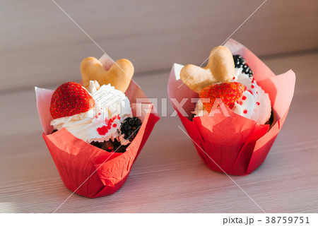 festive cupcakes with cream and fresh strawberries festive cupcakes with cream and fresh strawberries 38759751