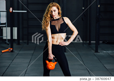 young athletic girl doing exercises in the gym young athletic girl doing exercises in the gym 38760647