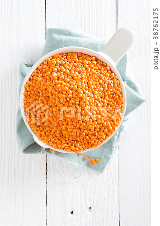 Raw lentil in bowl on table. Fresh lentils 38762175
