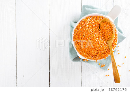 Raw lentil in bowl on table. Fresh lentils 38762176
