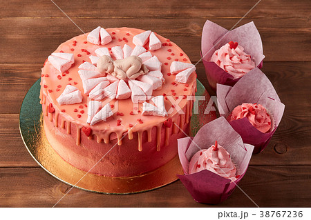 Pink baby shower cake on wooden background Pink baby shower cake on wooden background 38767236