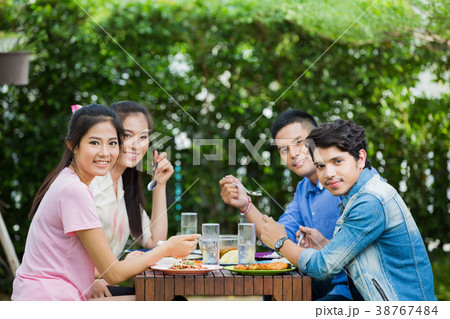 Asian ethnicity Having breakfast in the garden  38767484