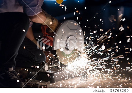 Worker use electric steel cutter machine. Worker use electric steel cutter machine. 38768299