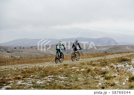 mountain trail two athlete cyclist mountain trail two athlete cyclist 38769344