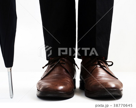 Stylish men's shoes and an umbrella 38770645