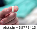 Man hands with  pills Capsule close-up on colorful 38773413