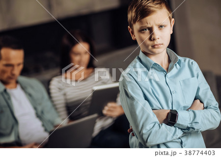 Pre-teen boy being sad about lack of parents Pre-teen boy being sad about lack of parents 38774403