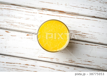 Orange juice on white wooden table Orange juice on white wooden table 38775053