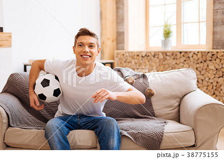 Inspired teenager holding a soccer ball Inspired teenager holding a soccer ball 38775155