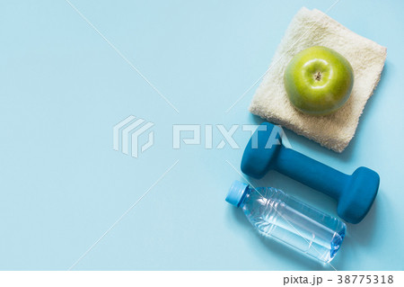 Sport and fitness equipment. Flat lay on blue. 38775318
