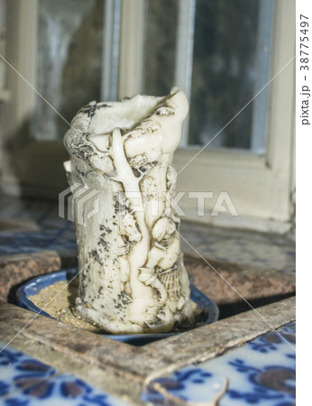 Old vintage carved candle with figures 38775497