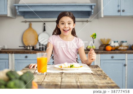 Glad girl and having healthy breakfast Glad girl and having healthy breakfast 38777458