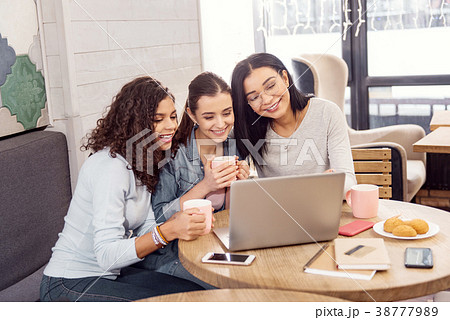 Energetic three students admiring their work Energetic three students admiring their work 38777989