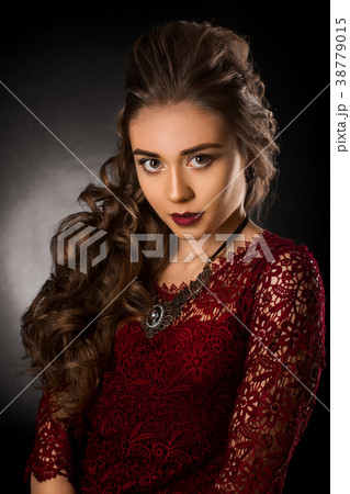 Charming young girl with beautiful curly hairstyle 38779015