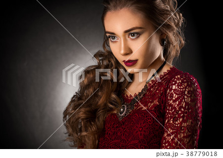 Charming young girl with beautiful curly hairstyle Charming young girl with beautiful curly hairstyle 38779018