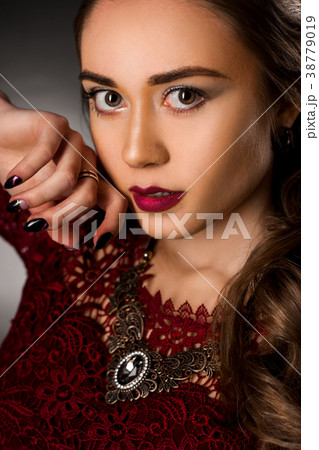 Charming young girl with beautiful curly hairstyle 38779019