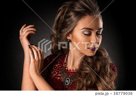 Charming young girl with beautiful curly hairstyle Charming young girl with beautiful curly hairstyle 38779036