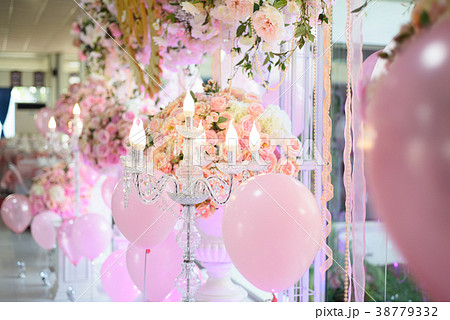 The candlesicks and balloon decorate in backdrop 38779332