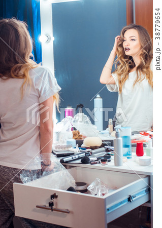 Young gorgeous woman with curly hairstyle and Young gorgeous woman with curly hairstyle and 38779654