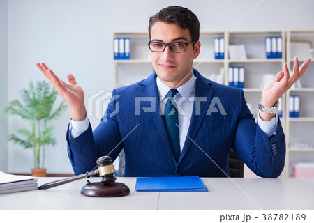 Young lawyer judge sitting in the office 38782189