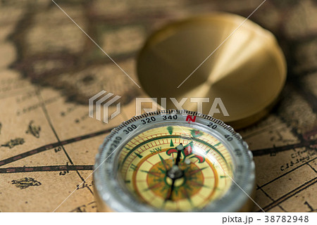 Old compass on vintage map Old compass on vintage map 38782948