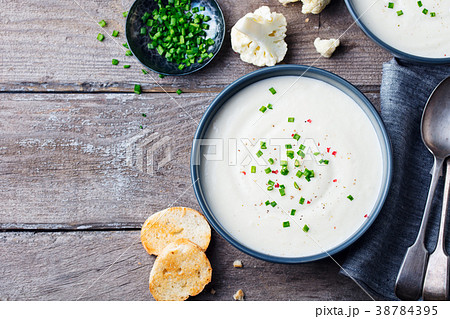 Cauliflower, potato cream soup in bowl Copy space. 38784395