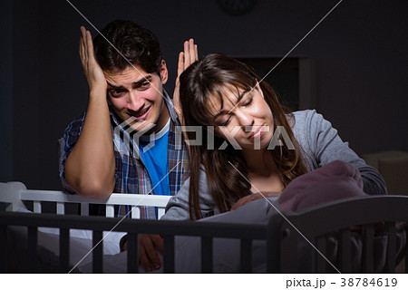 Young parents sleepless with newborn baby at night Young parents sleepless with newborn baby at night 38784619