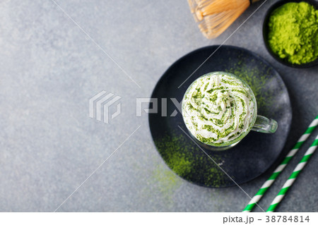 Matcha green tea latte, whipped cream. Copy space 38784814