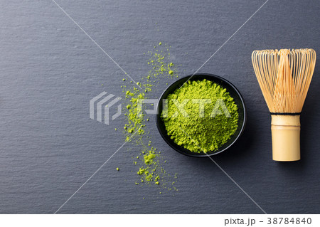 Matcha, green tea powder in black bowl Top view. Matcha, green tea powder in black bowl Top view. 38784840