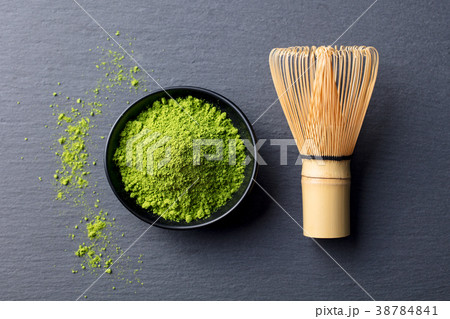 Matcha, green tea powder in black bowl Top view. 38784841
