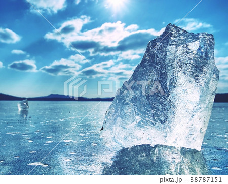 The rays of the sun creat shadows in blue ice 38787151