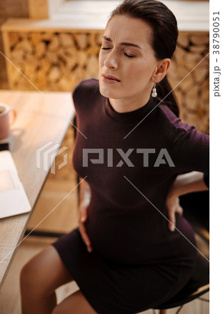 Charming pregnant woman experiencing pain in back 38790051