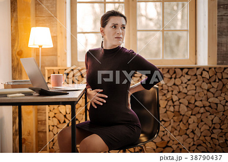 Worried upset pregnant businesswoman feeling 38790437