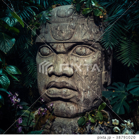 Olmec sculpture carved from stone. Big stone head Olmec sculpture carved from stone. Big stone head 38791020