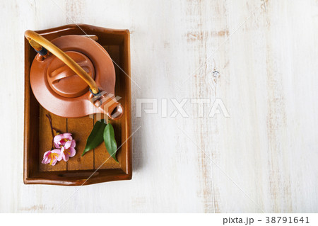 Ceramic teapot, tea leaves and sakura 38791641