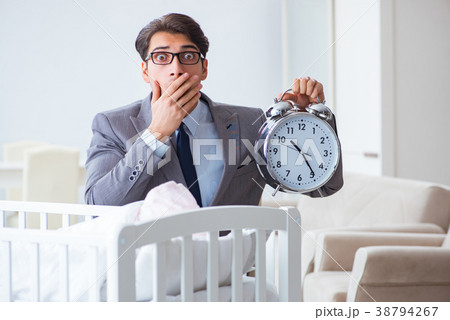 Young businessman trying to work from home caring Young businessman trying to work from home caring 38794267