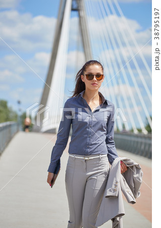 Woman enjoying sunset in the city near river. Lifestyle , relax 38795197