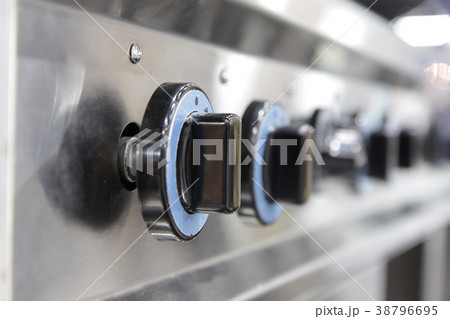 Close up switch of Kitchen burning gas cooker 38796695