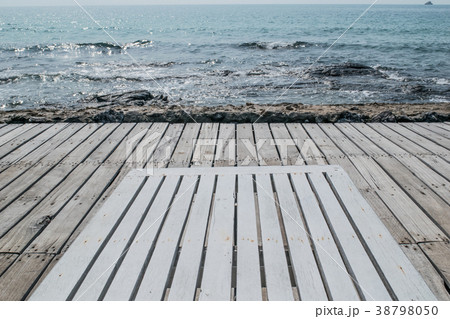 wooden beach chair on the floor at seaside 38798050
