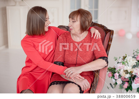 Mature Mother And Daughter Hugging. Mature Mother And Daughter Hugging. 38800659