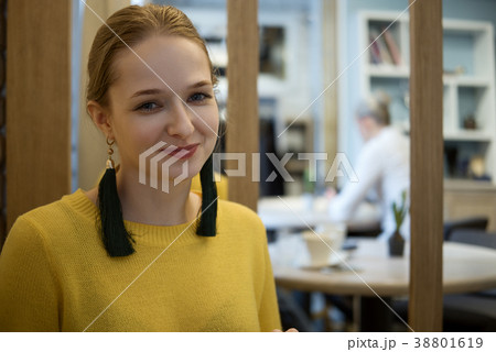 girl near mirror with reflection of office in it girl near mirror with reflection of office in it 38801619