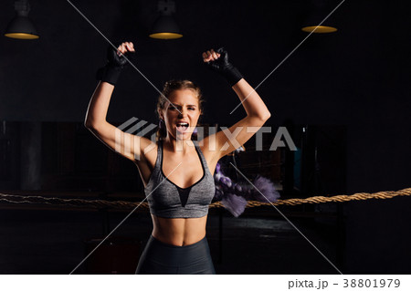 Young fashion boxer girl with boxing gloves Young fashion boxer girl with boxing gloves 38801979