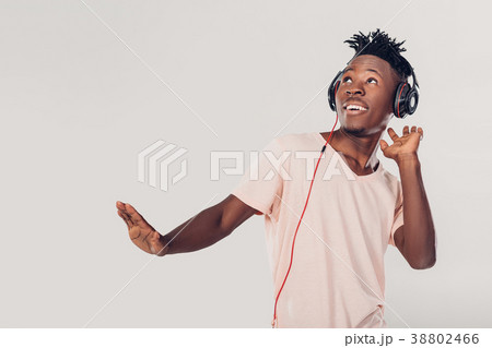 African-American man in headphones listening to African-American man in headphones listening to 38802466