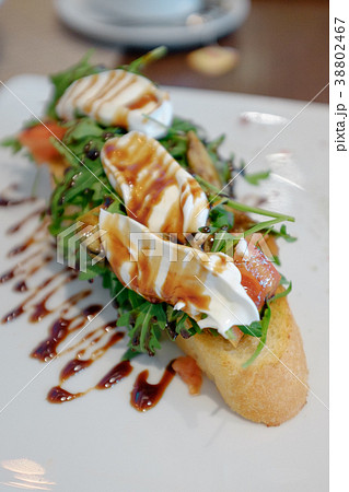 Bruschetta with arugula and cream Bruschetta with arugula and cream 38802467