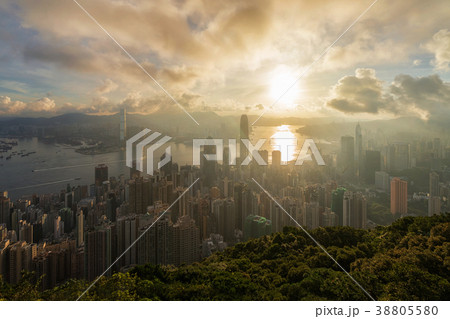 Aerial View of Hong Kong Cityscape on the sunrise time from the peak location which can see down town and Victoria harbour Aerial View of Hong Kong Cityscape on the sunrise time from the peak location which can see down town and Victoria harbour 38805580
