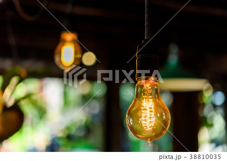 Incandescent lamps in wooden room. Edison lamp. 38810035