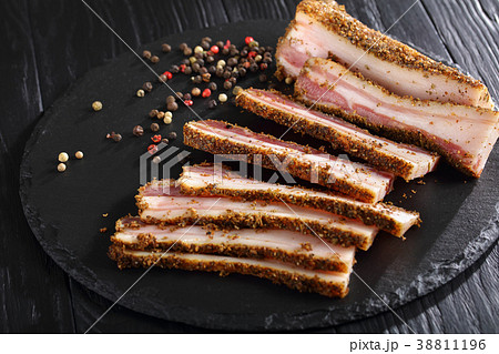 sliced spicy smoked speck, top view sliced spicy smoked speck, top view 38811196